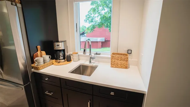 a room with a sink and a mirror