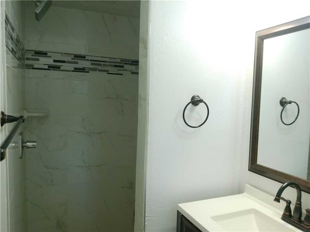 4117 Monaco Street Corpus Christi, TX 78411 - Photo 15 of 17 a bathroom with a toilet and a sink