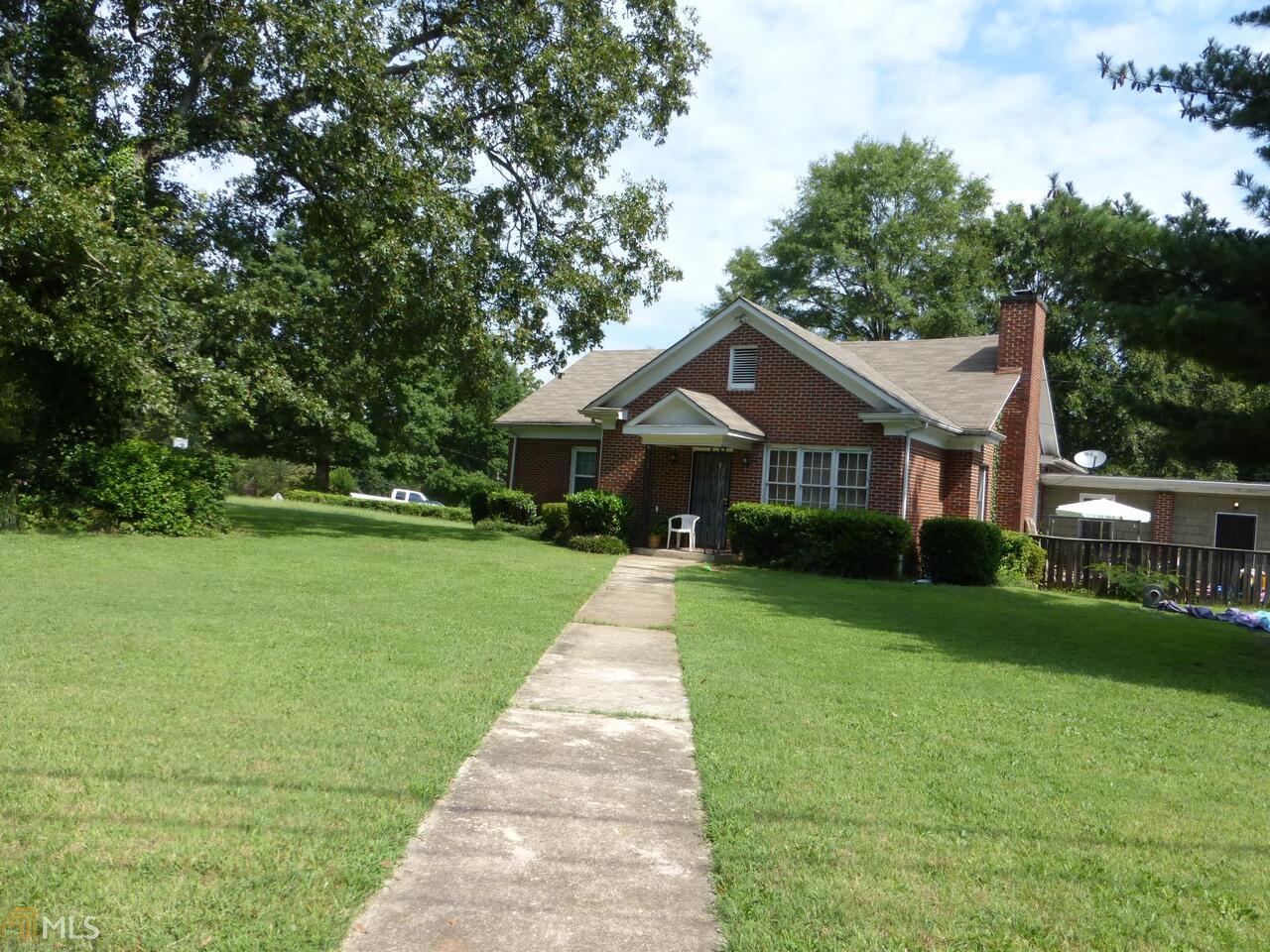 2896 Toney Drive, Unit 13 Decatur, GA 30032 - Photo 1 of 1 a front view of a house with a yard