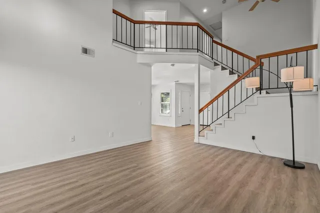 a view of staircase with white walls and a window