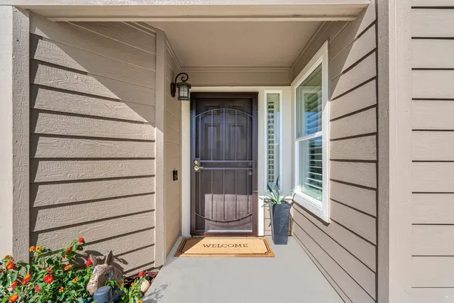 a view of house with wooden door and wooden floor