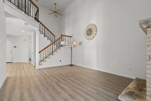 a view of an entryway with wooden floor