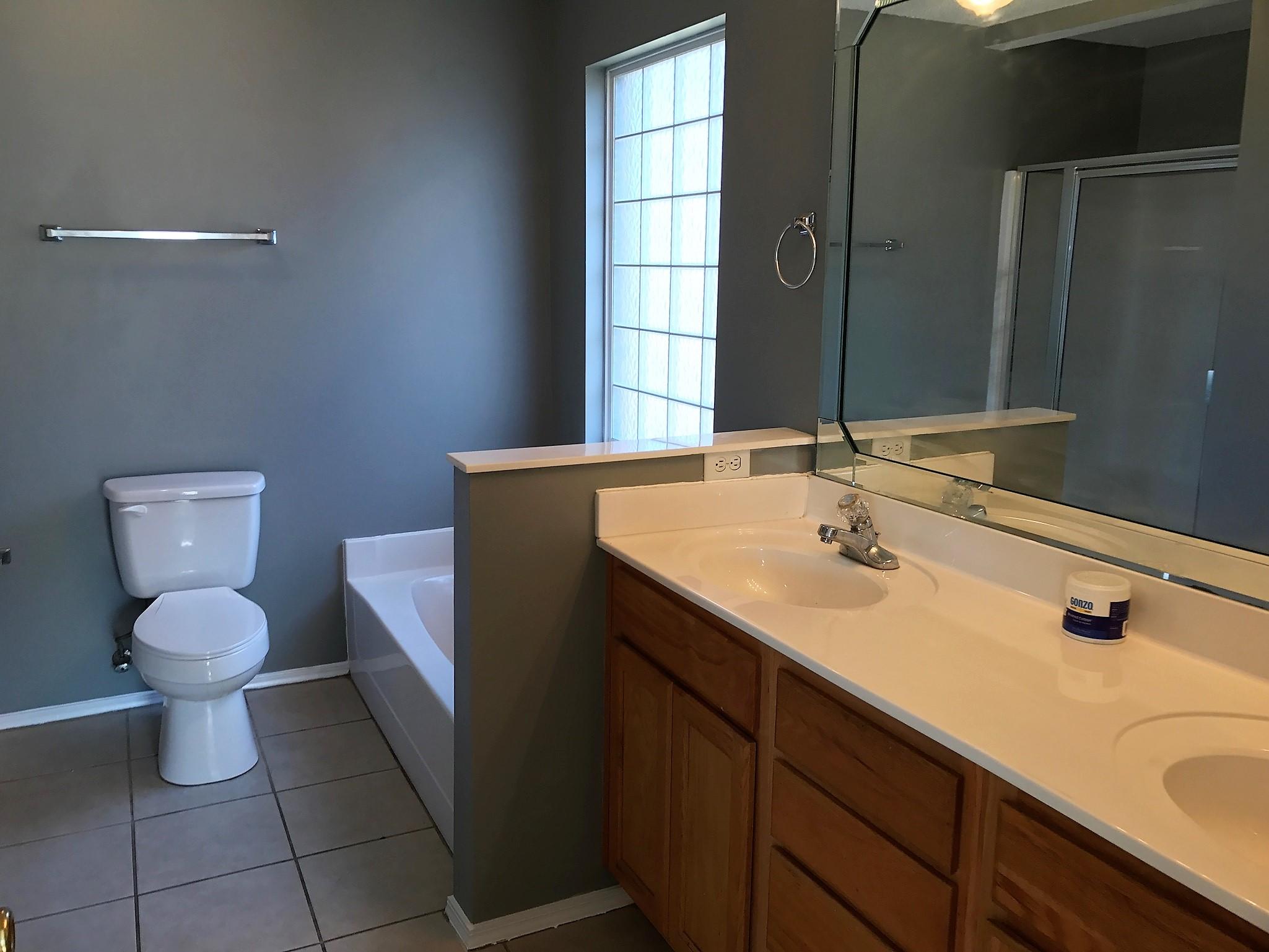 804 Travis Court Crestview, FL 32536 - Photo 16 of 22 a bathroom with a sink toilet and vanity