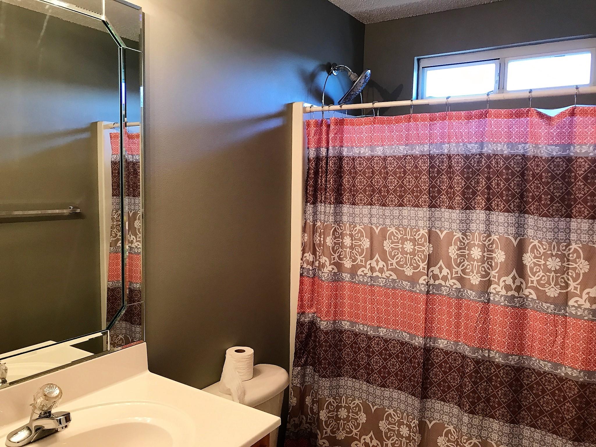 804 Travis Court Crestview, FL 32536 - Photo 17 of 22 a bedroom with a bed and a window