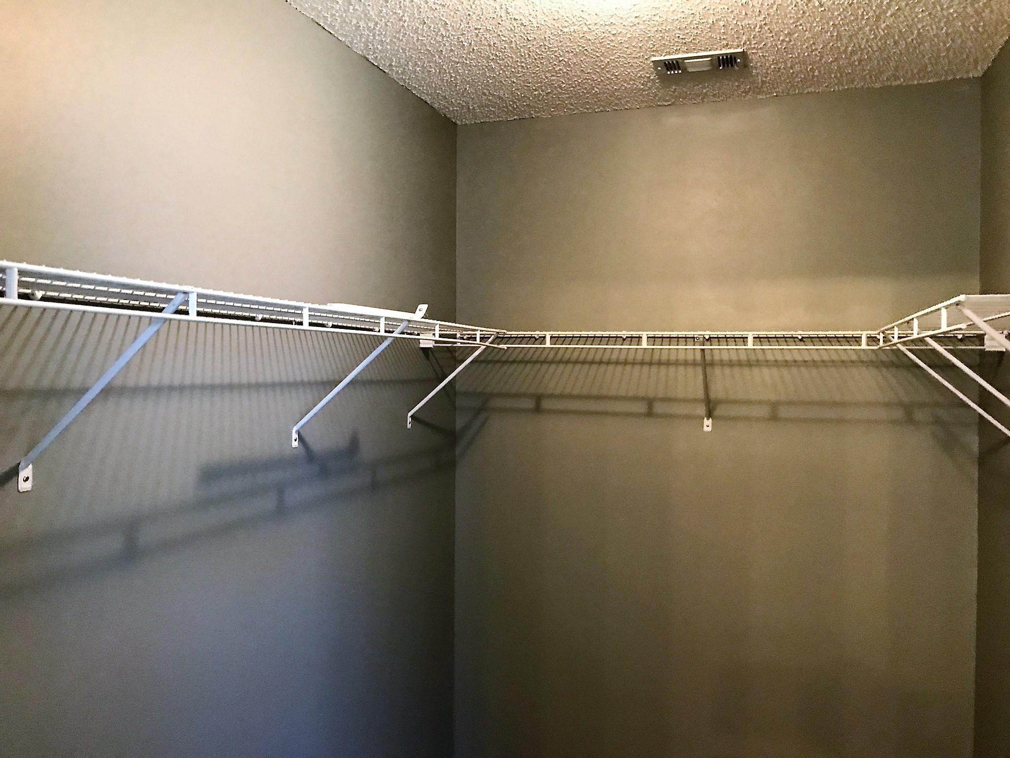 804 Travis Court Crestview, FL 32536 - Photo 22 of 22 a view of a room with racks on the wall