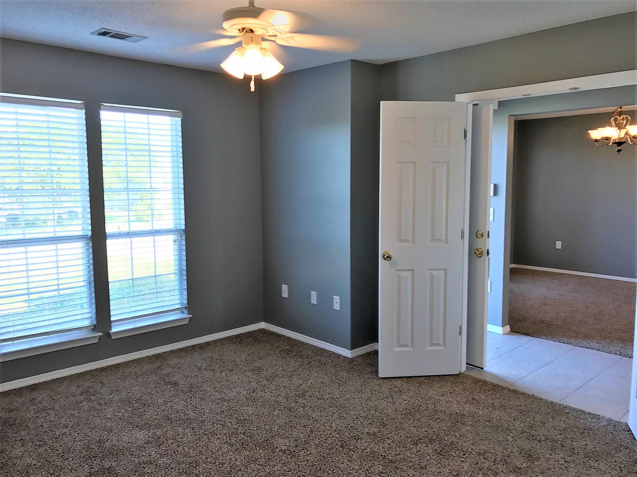 804 Travis Court Crestview, FL 32536 - Photo 6 of 22 a view of an empty room with a window
