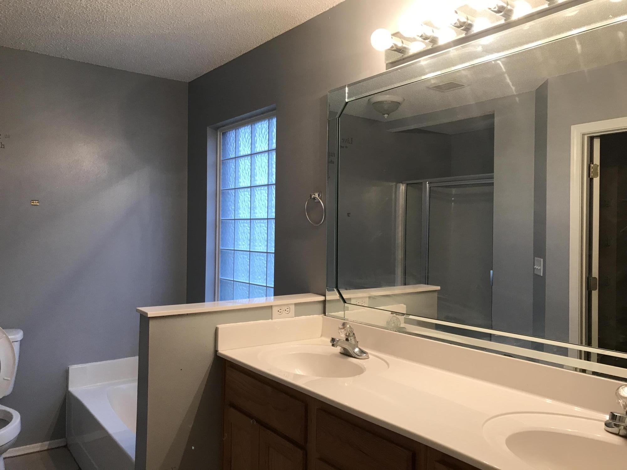 804 Travis Court Crestview, FL 32536 - Photo 9 of 22 a bathroom with a sink and a mirror