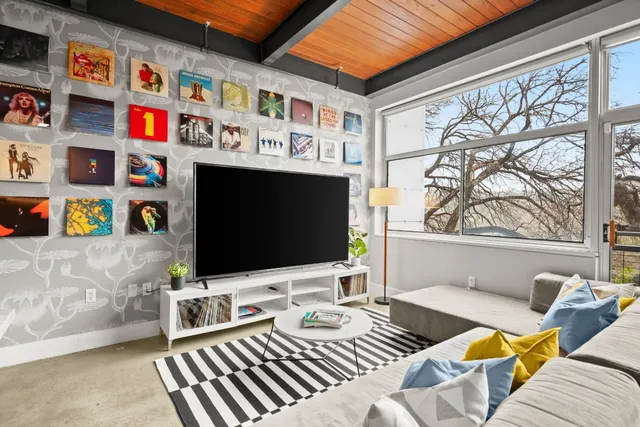 a living room with furniture and a large window