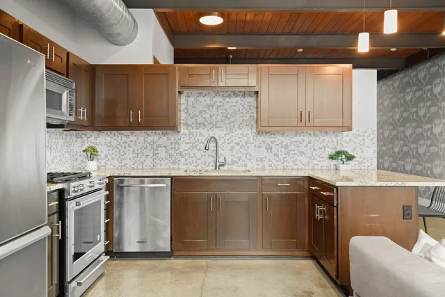 a outdoor living space with furniture and a flat screen tv