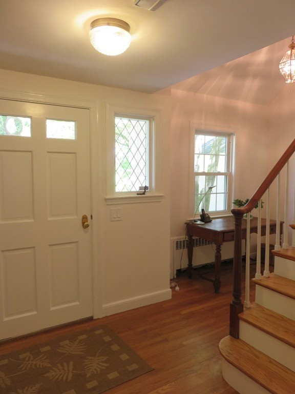 52 Montvale Road Weston, MA 02493 - Photo 16 of 30 a view of a livingroom with wooden floor and furniture