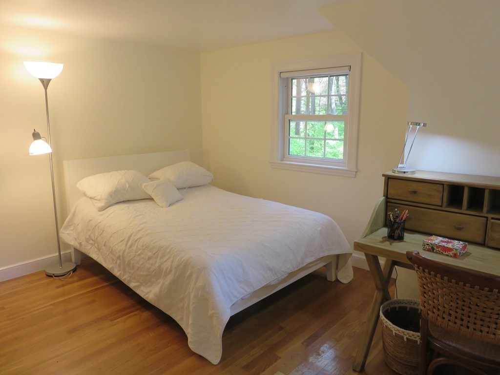 52 Montvale Road Weston, MA 02493 - Photo 20 of 30 a bedroom with a bed and a window