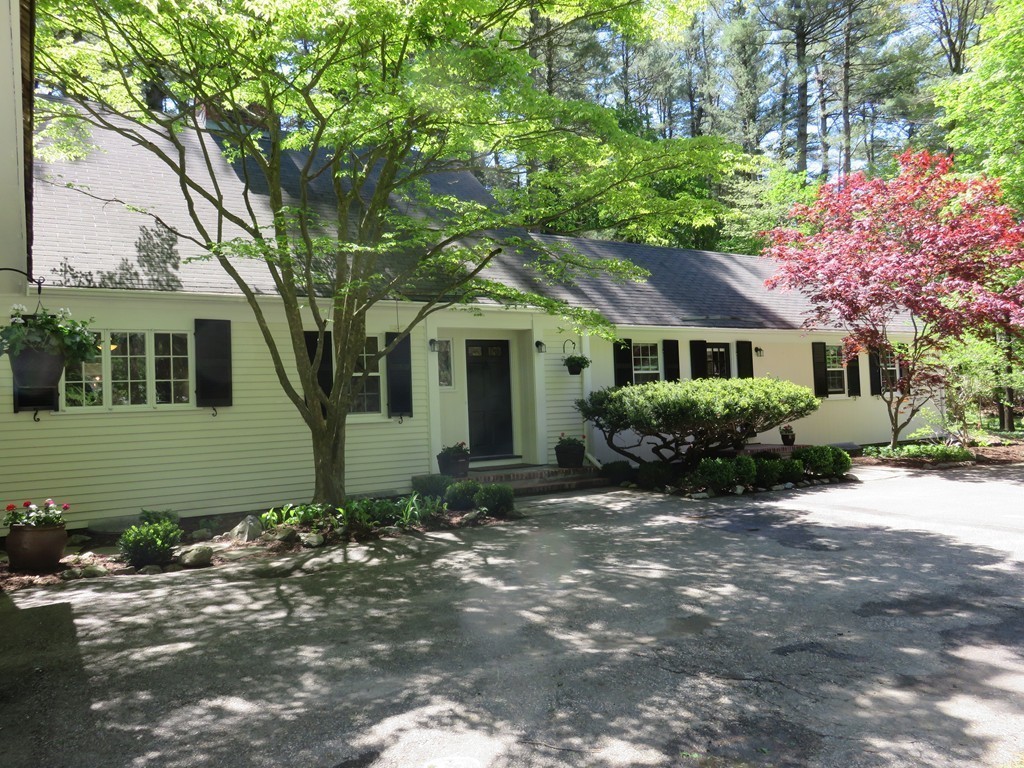 52 Montvale Road Weston, MA 02493 - Photo 2 of 30 a front view of a house with a garden