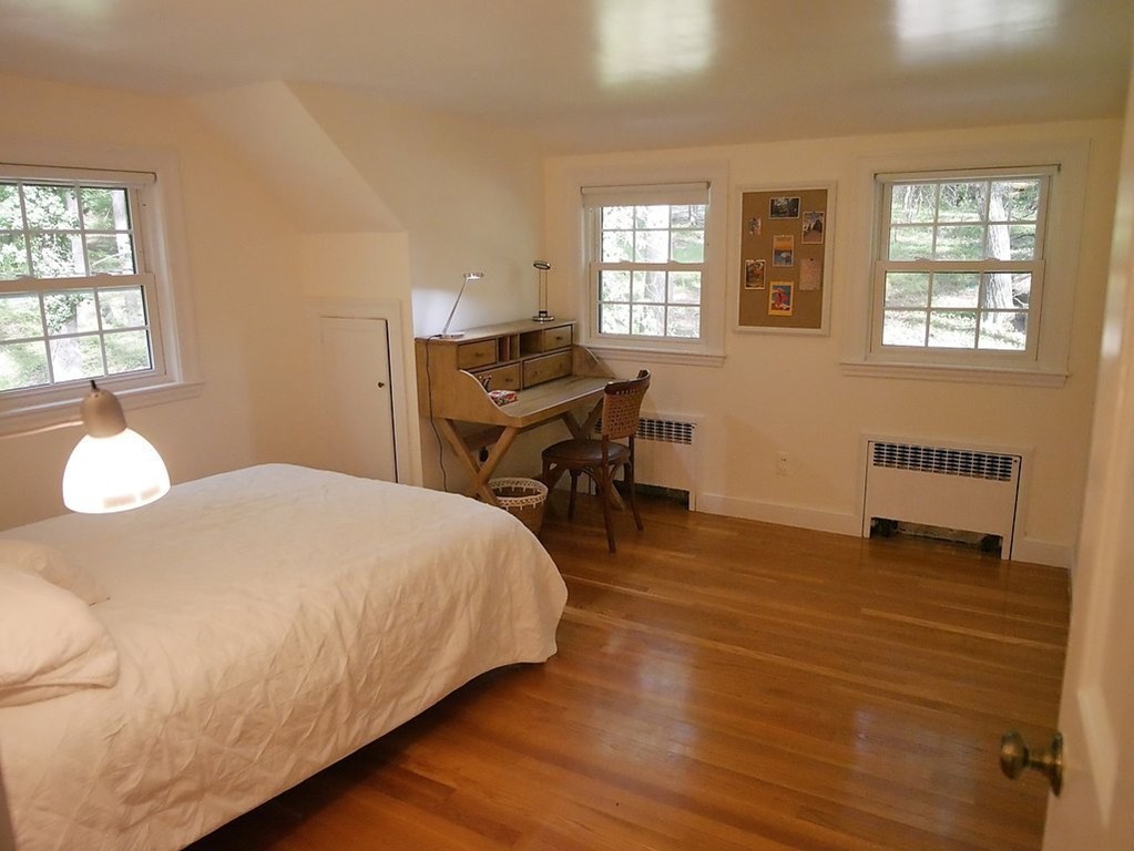 52 Montvale Road Weston, MA 02493 - Photo 21 of 30 a bedroom with a bed and a table
