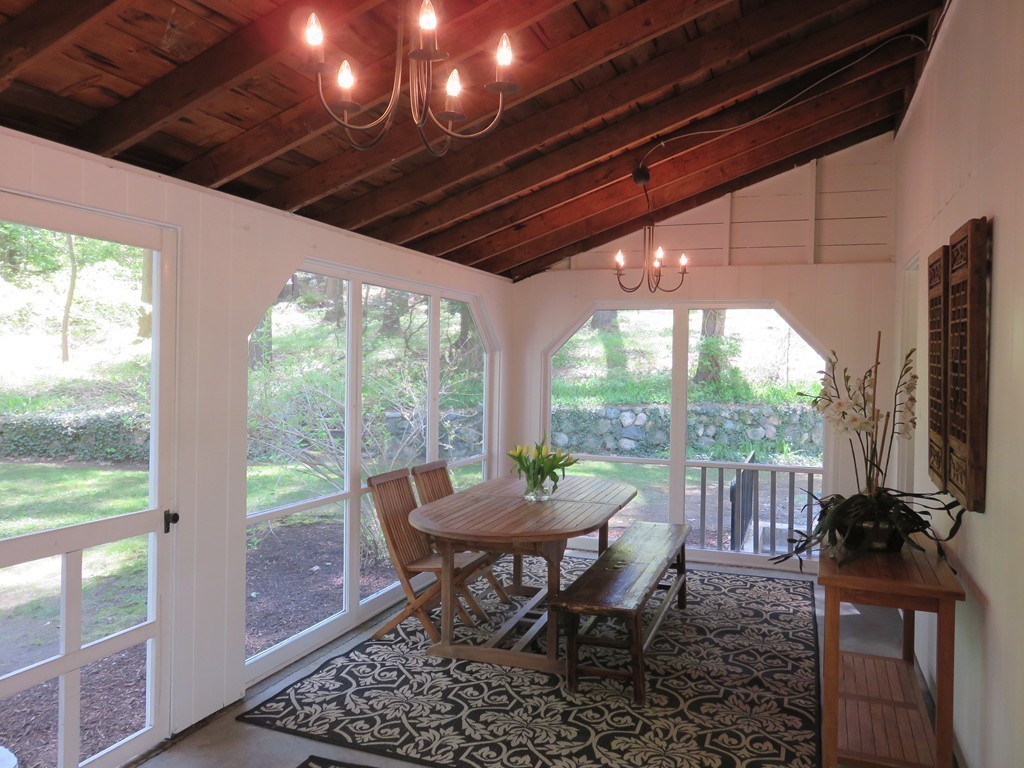 52 Montvale Road Weston, MA 02493 - Photo 27 of 30 a view of a porch with furniture and a yard