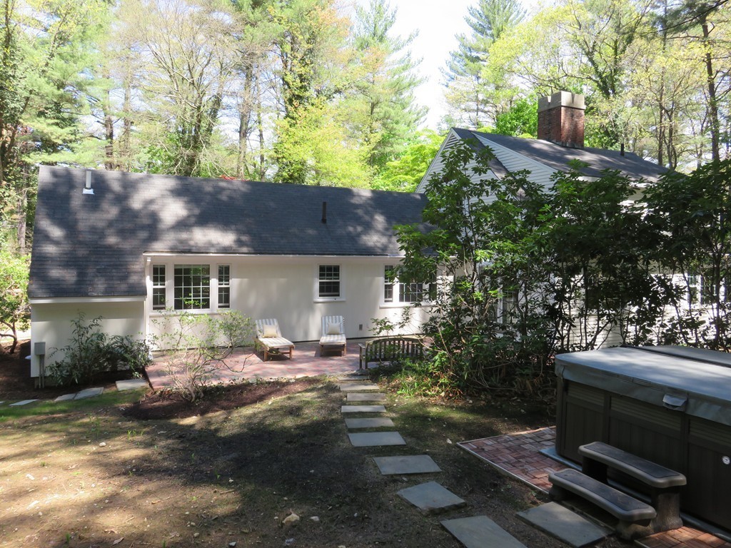 52 Montvale Road Weston, MA 02493 - Photo 28 of 30 a view of a house with backyard sitting area and garden