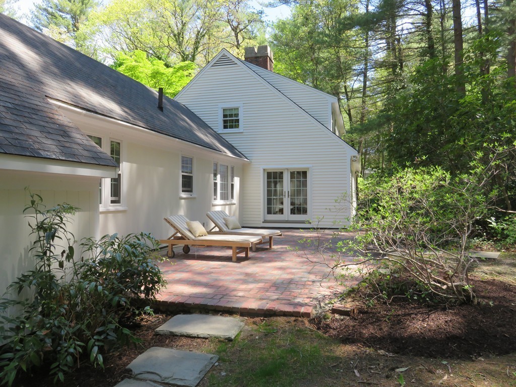 52 Montvale Road Weston, MA 02493 - Photo 29 of 30 a backyard of a house with yard and outdoor seating