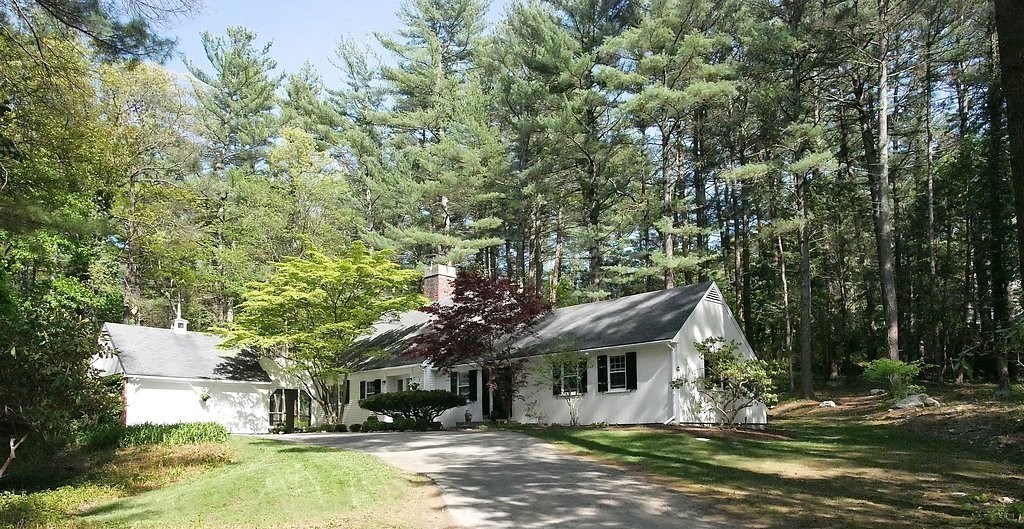 52 Montvale Road Weston, MA 02493 - Photo 4 of 30 a front view of a house with a yard