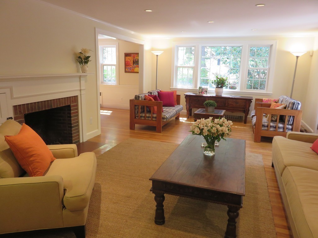 52 Montvale Road Weston, MA 02493 - Photo 7 of 30 a living room with furniture fireplace and large windows