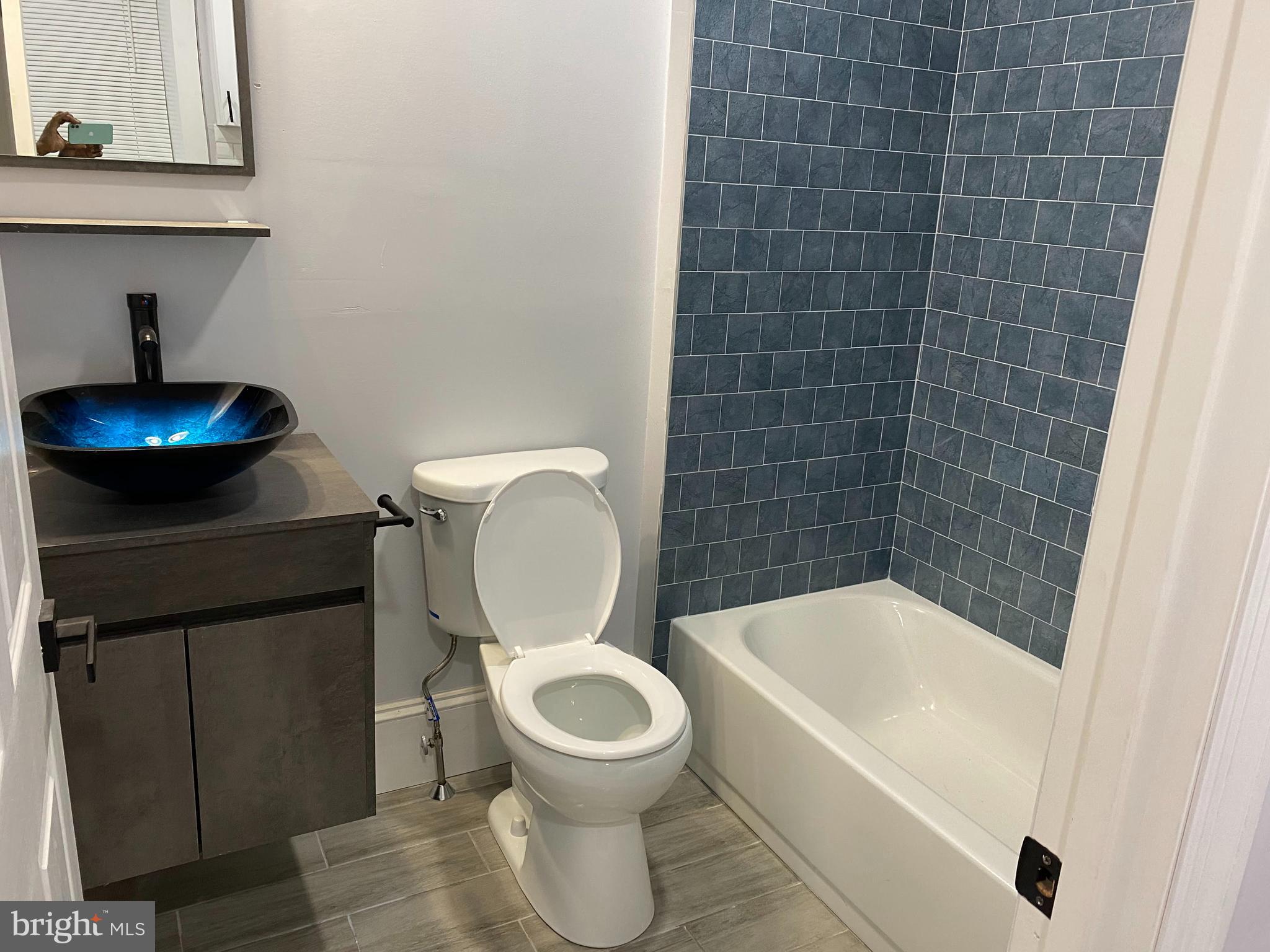 5608 Sprague Street, Unit A Philadelphia, PA 19138 - Photo 6 of 11 a bathroom with a toilet and a bathtub