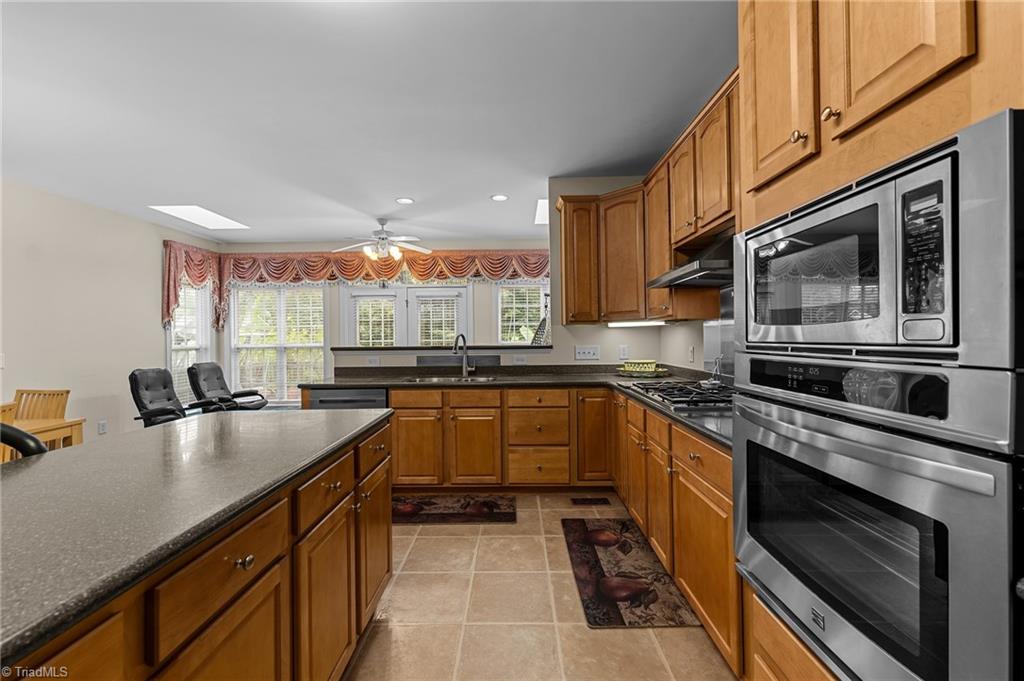701 Number Ten Way Oak Ridge, NC 27310 - Photo 12 of 48 KITCHEN INCLUDES A LARGE WORK ISLAND
