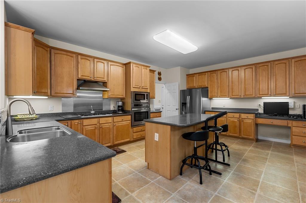 701 Number Ten Way Oak Ridge, NC 27310 - Photo 13 of 48 KITCHEN HAS A TON OF CABINETS!