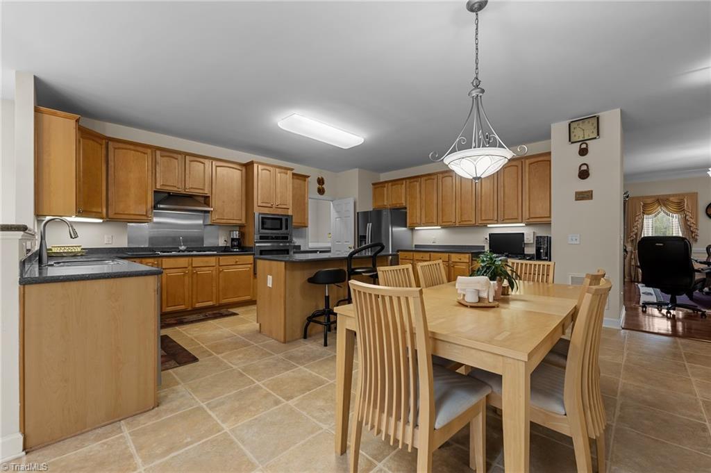 701 Number Ten Way Oak Ridge, NC 27310 - Photo 15 of 48 BREAKFAST AREA AND KITCHEN ARE HUGE!