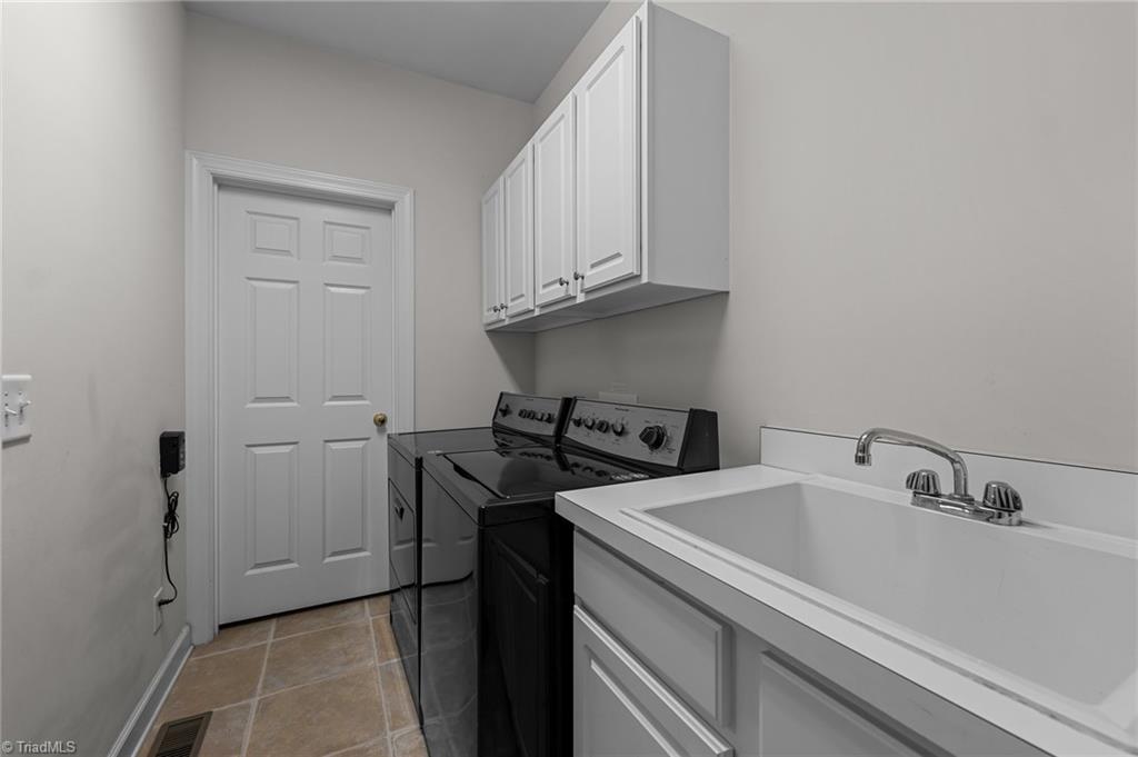 701 Number Ten Way Oak Ridge, NC 27310 - Photo 16 of 48 LAUNDRY AND GENEROUS PANTRY BEYOND