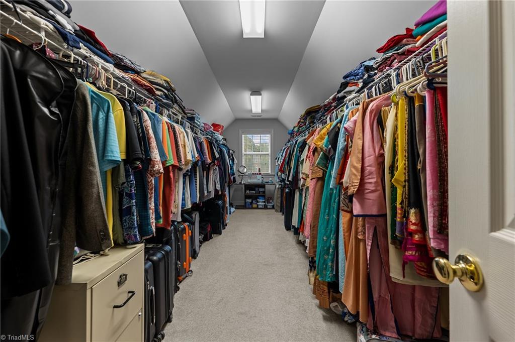 701 Number Ten Way Oak Ridge, NC 27310 - Photo 23 of 48 THE PRIMARY WLAK IN CLOSET IS LARGE ENOUGH FOR ALL YOUR STORAGE NEEDS