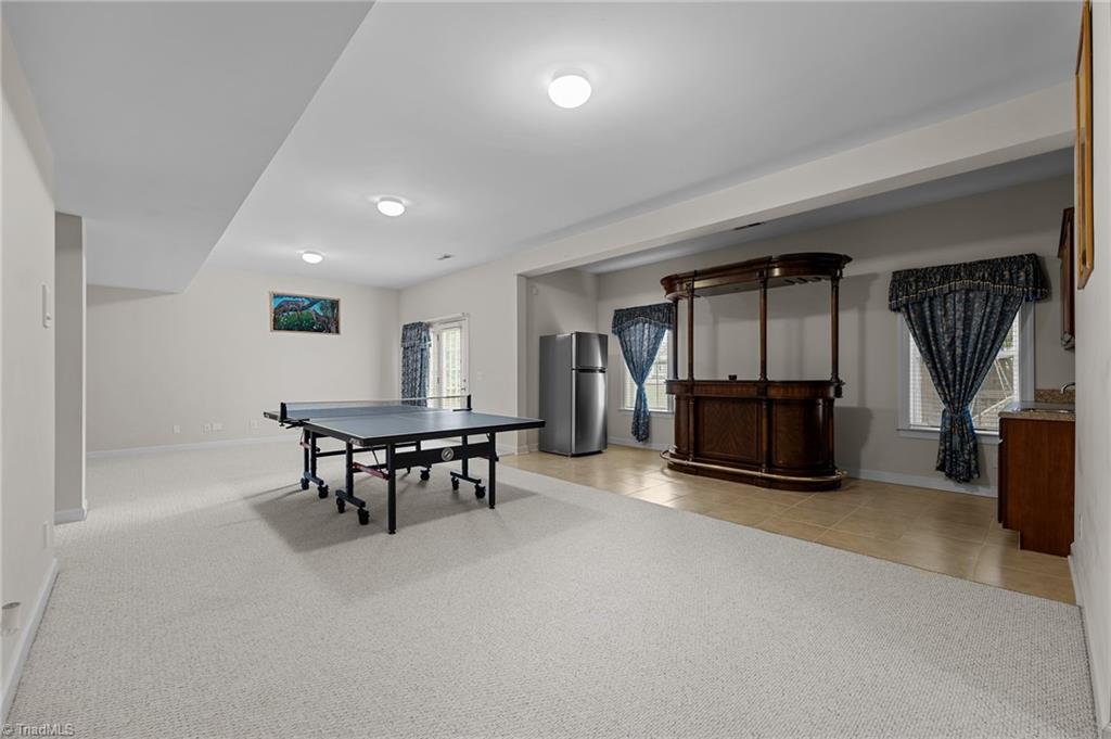 701 Number Ten Way Oak Ridge, NC 27310 - Photo 27 of 48 THE LOWER LEVEL RECREATION ROOM IS GIGANTIC!