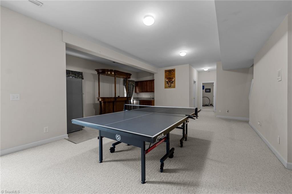 701 Number Ten Way Oak Ridge, NC 27310 - Photo 29 of 48 RECREATION ROOM ALSO HAS A WET BAR