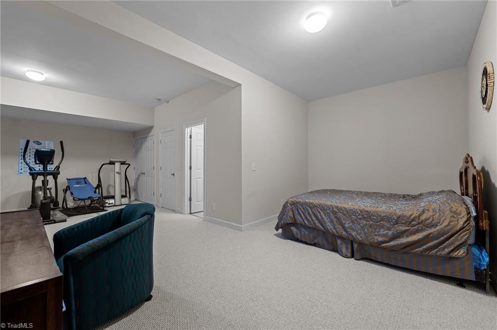 701 Number Ten Way Oak Ridge, NC 27310 - Photo 33 of 48 GYM AND SLEEPING AREA COMBINED OR USE IT AS AN IN-LAW SUITE