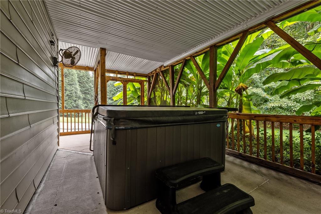 701 Number Ten Way Oak Ridge, NC 27310 - Photo 34 of 48 HOT TUB TIME! YOU CAN ENJOY THIS IN ANY WEATHER WITH THE DRY DECK ABOVE.