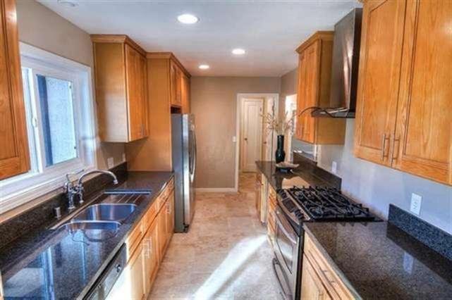 160 Burnham Road Oak View, CA 93022 - Photo 3 of 14 a kitchen with sink a stove and a refrigerator