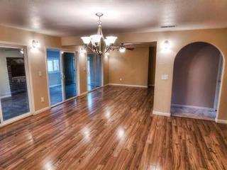 160 Burnham Road Oak View, CA 93022 - Photo 8 of 14 an empty room with wooden floor chandelier and entryway