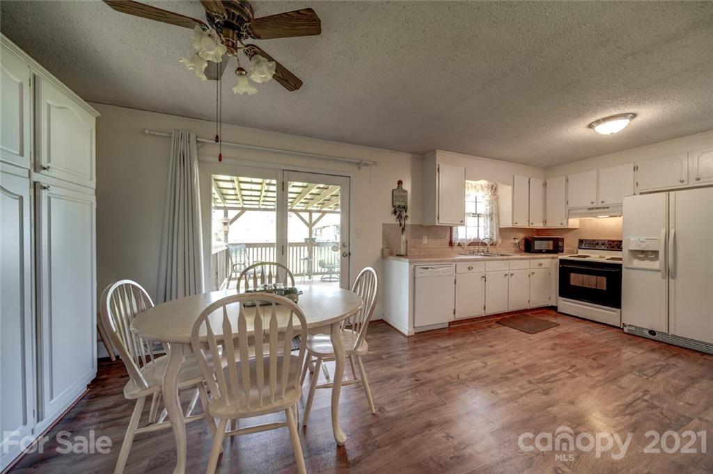 3007 Sikes Mill Road Monroe, NC 28110 - Photo 14 of 42 a view of a dining room with furniture window and outside view