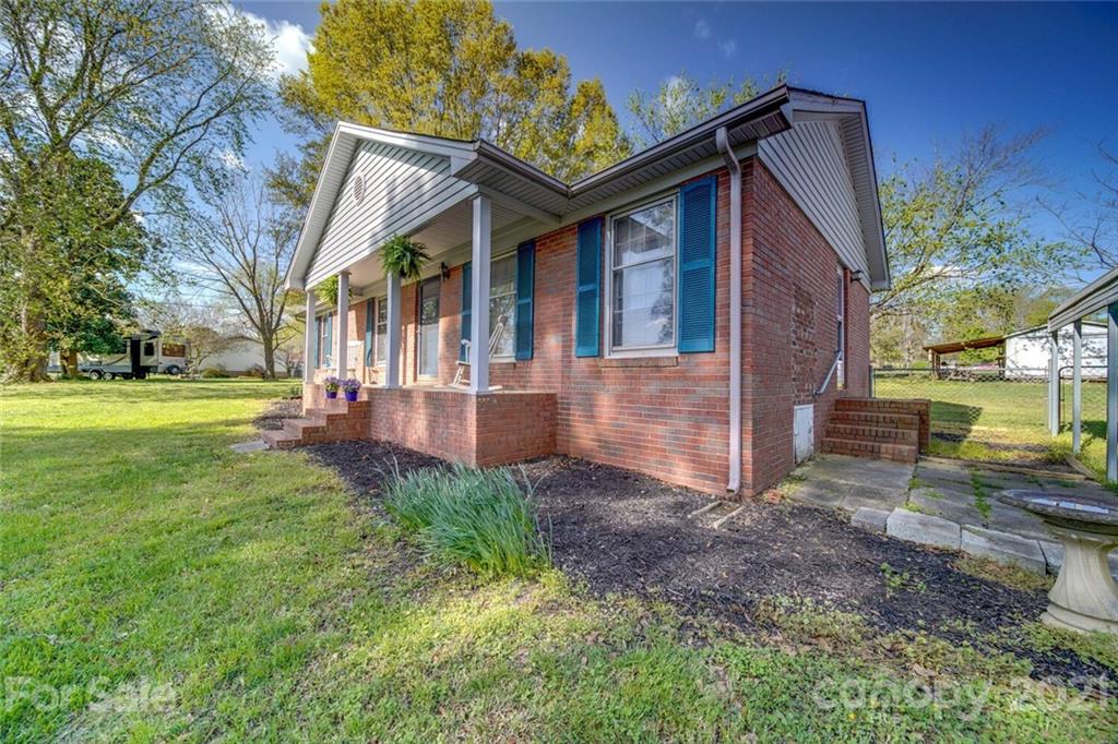 3007 Sikes Mill Road Monroe, NC 28110 - Photo 3 of 42 a view of a house with a yard