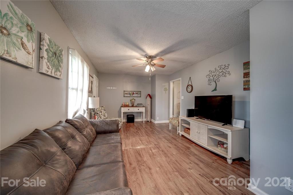 3007 Sikes Mill Road Monroe, NC 28110 - Photo 40 of 42 a living room with furniture and a flat screen tv
