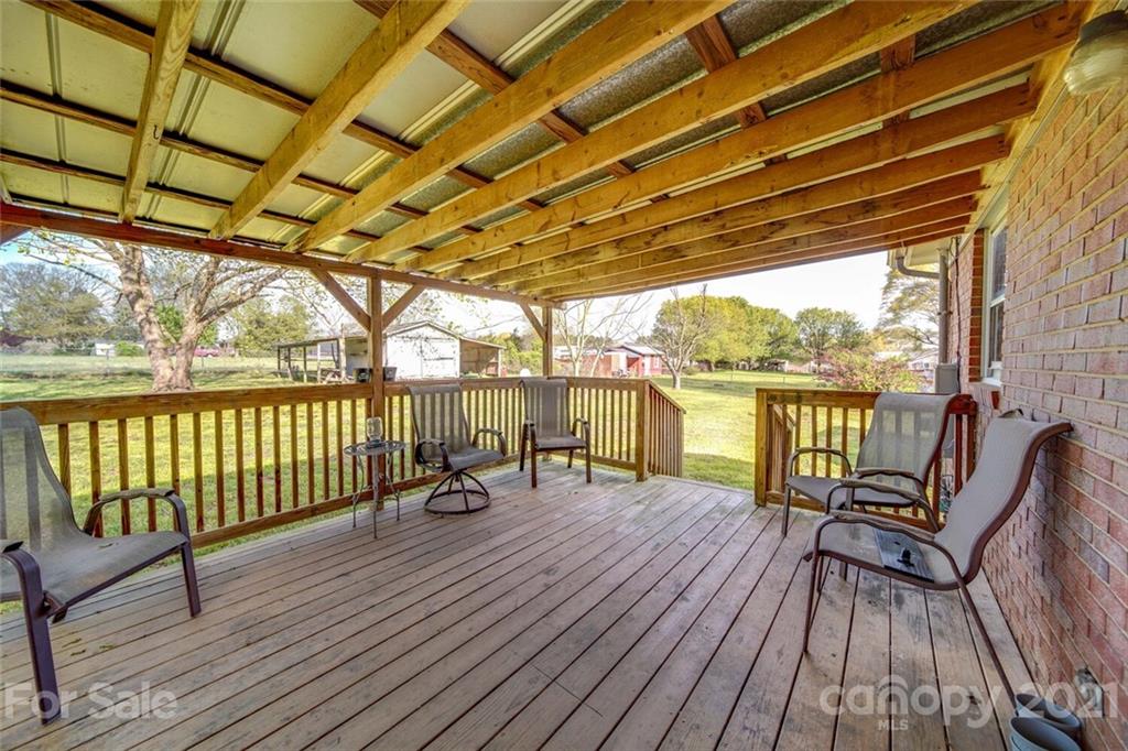3007 Sikes Mill Road Monroe, NC 28110 - Photo 8 of 42 a view of deck with wooden floor and outdoor seating