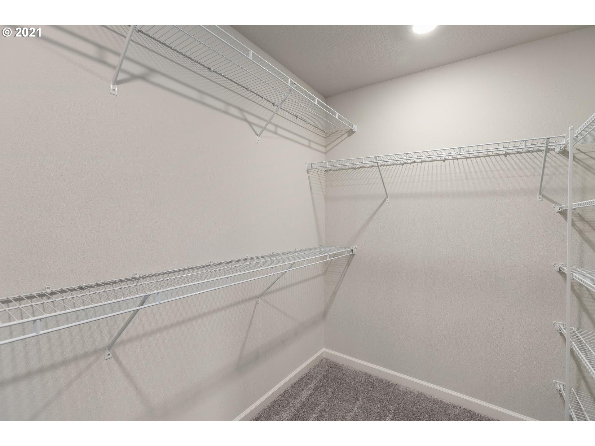 2364 South Brookside Place Ridgefield, WA 98642 - Photo 11 of 28 a view of a room with racks on the wall