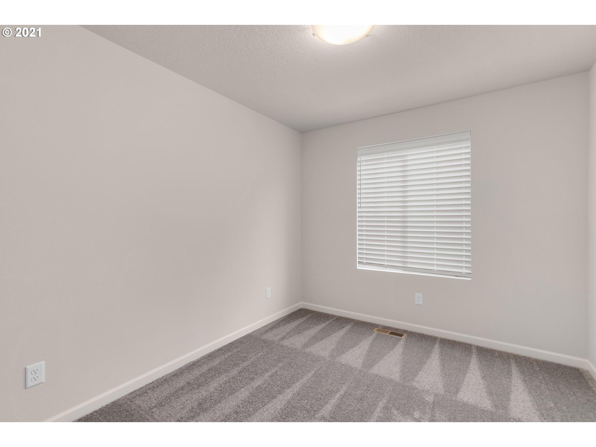 2364 South Brookside Place Ridgefield, WA 98642 - Photo 12 of 28 a view of an empty room with a window