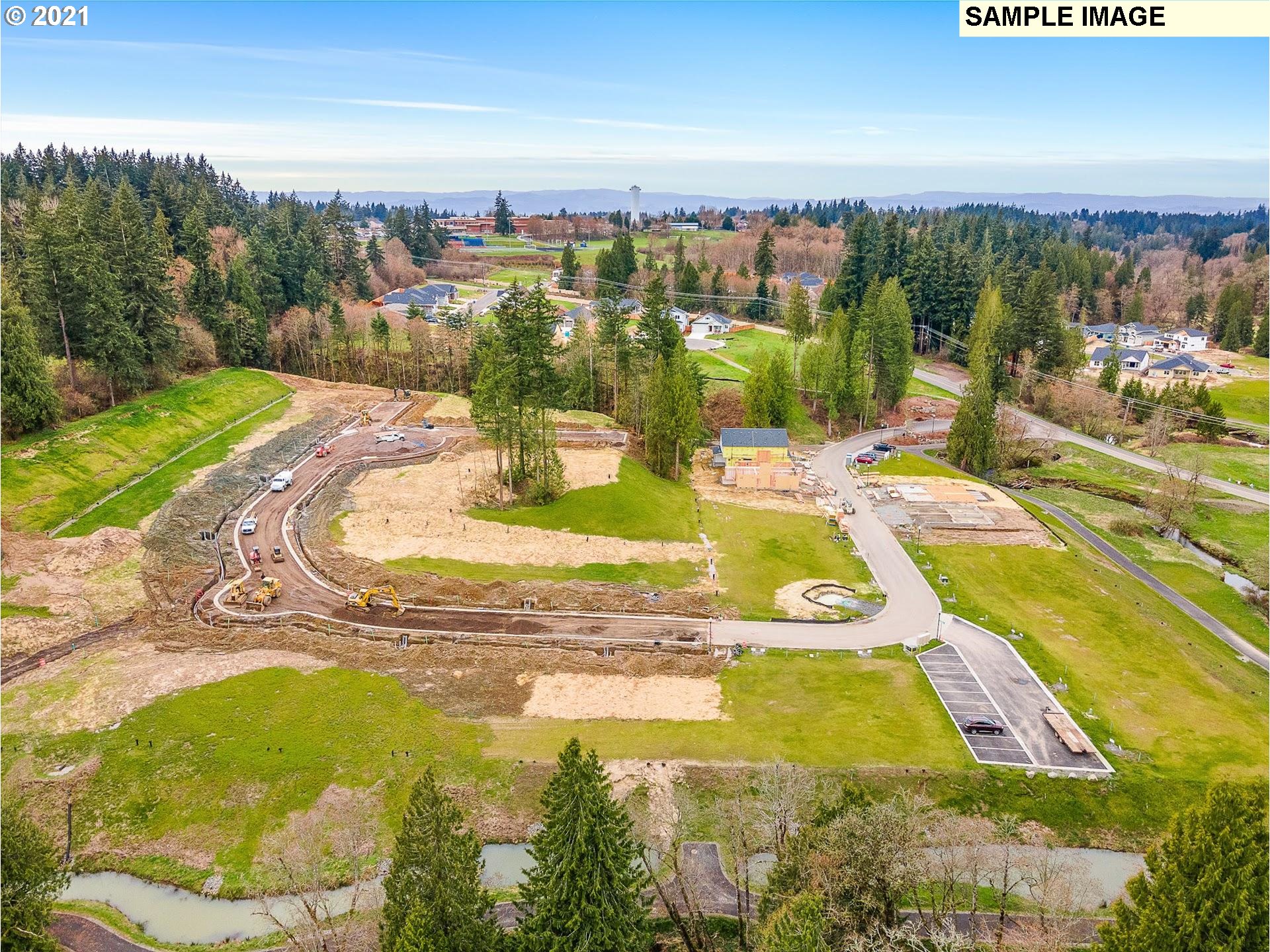 2364 South Brookside Place Ridgefield, WA 98642 - Photo 26 of 28 a view of a swimming pool with an ocean view