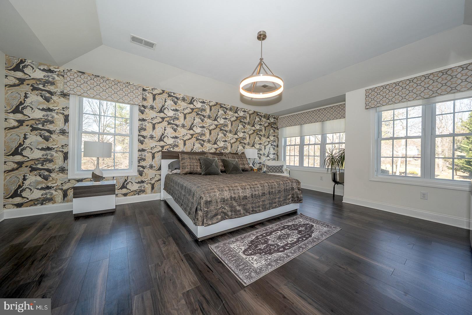 1300 Sugartown Road Berwyn, PA 19312 - Photo 54 of 120 a bedroom with a bed and wooden floor