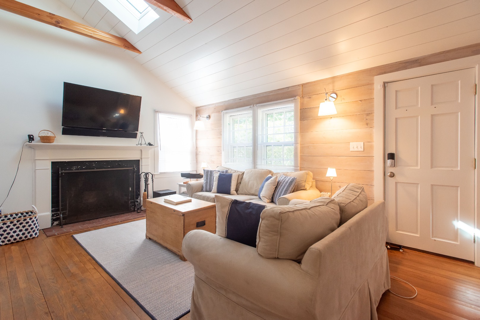16 H Milestone Road, Unit 8 DIONIS Nantucket, MA 02554 - Photo 10 of 22 a living room with furniture a flat screen tv and a fireplace