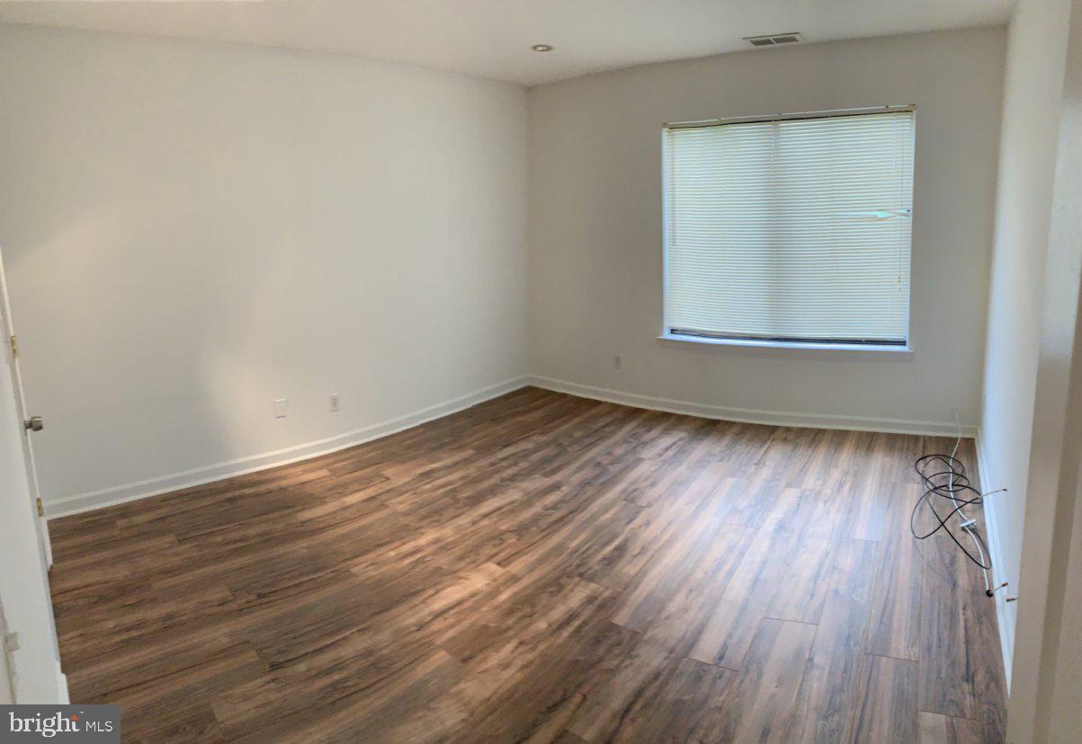 88 Sandra Road Voorhees, NJ 08043 - Photo 5 of 9 an empty room with wooden floor and windows