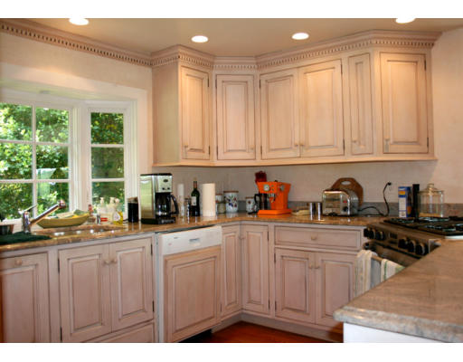 13 Lincoln Road Wayland, MA 01778 - Photo 6 of 21 a kitchen with stainless steel appliances granite countertop a stove a sink dishwasher and cabinets with wooden floor