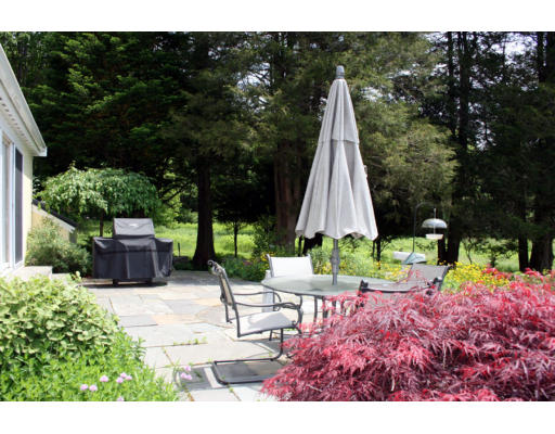13 Lincoln Road Wayland, MA 01778 - Photo 8 of 21 a view of backyard with plants and outdoor seating