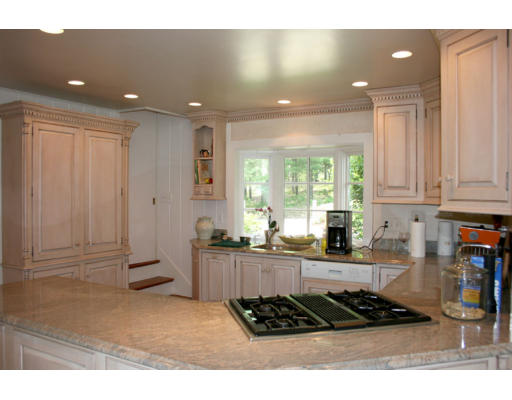 13 Lincoln Road Wayland, MA 01778 - Photo 9 of 21 a kitchen with stainless steel appliances granite countertop a stove a sink and a white cabinets