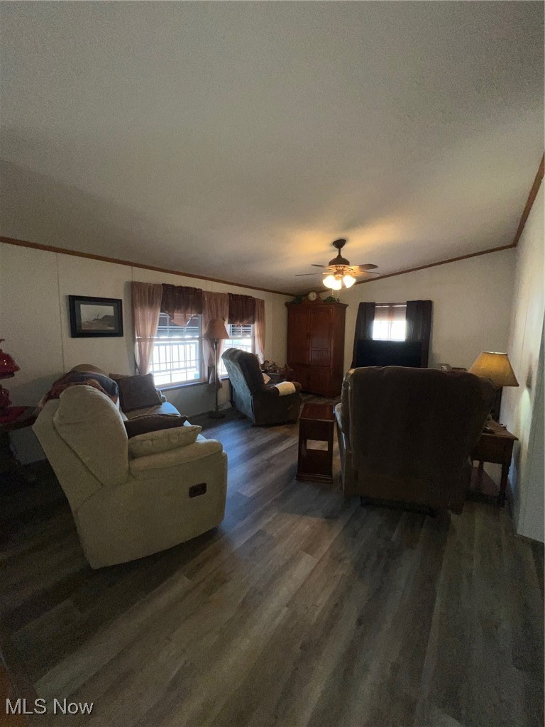 7716 Depot Road, Unit 7 Lisbon, OH 44432 - Photo 16 of 21 Plenty of natural light in family room with laminate flooring.