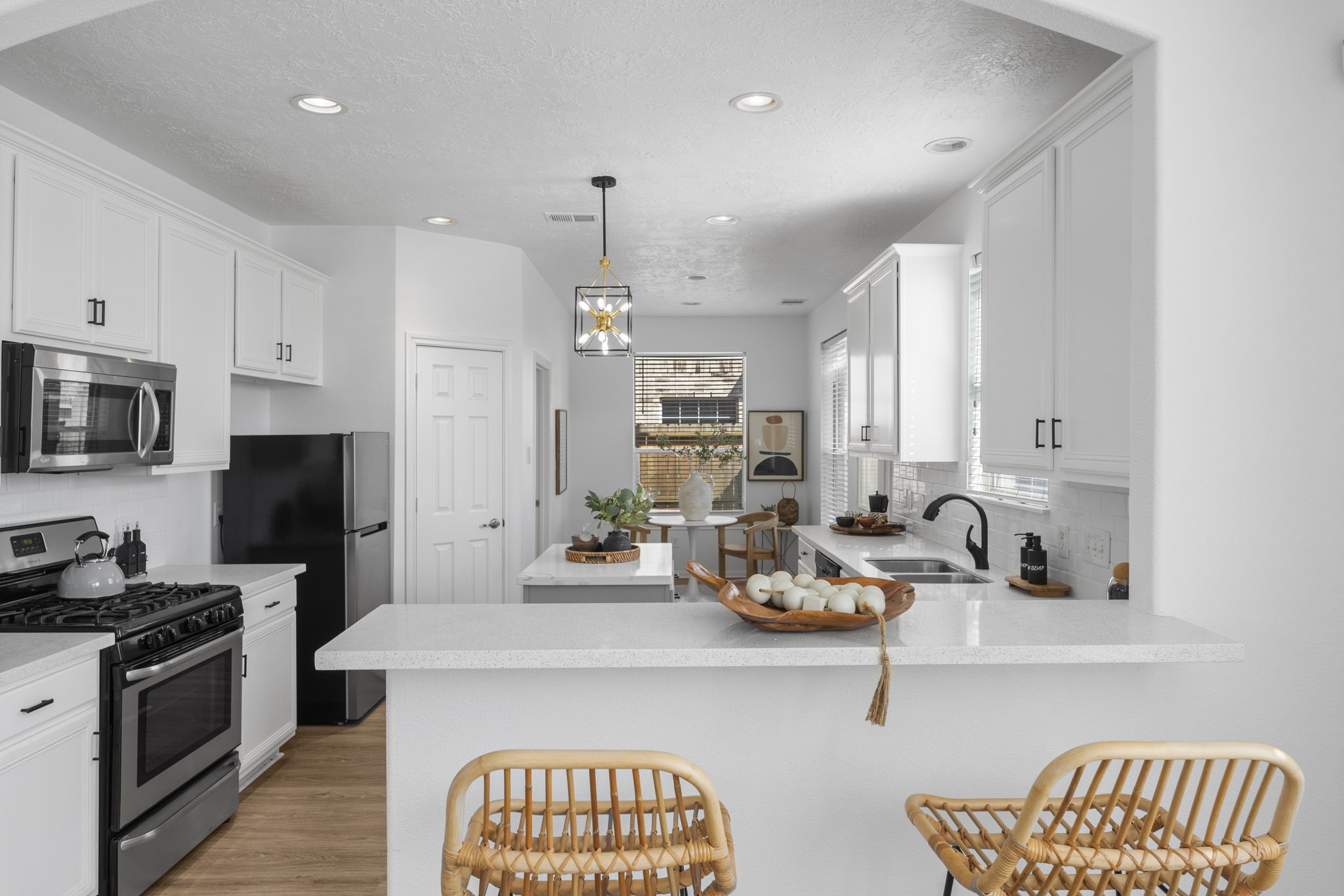 21418 Avalon Queen Drive Spring, TX 77379 - Photo 14 of 35 a kitchen with sink refrigerator and stove