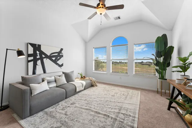 a living room with furniture and a window